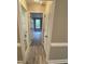Hallway features wood flooring and neutral paint at 4172 Saltwood Dr, Hickory, NC 28602