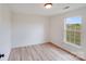 Neutral bedroom with natural light and light wood floors at 4227 Coopersdale Rd, Charlotte, NC 28273