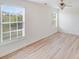 Bright room with two windows and durable wood flooring at 4227 Coopersdale Rd, Charlotte, NC 28273