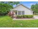 Charming single-story home featuring manicured lawn, flowering bushes, and neutral siding with classic curb appeal at 4227 Coopersdale Rd, Charlotte, NC 28273