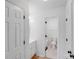 Bright hallway with two doors and durable flooring leading to a bathroom at 4227 Coopersdale Rd, Charlotte, NC 28273