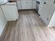 Kitchen featuring bright white cabinets, stainless appliances, and light hardwood floors at 4227 Coopersdale Rd, Charlotte, NC 28273