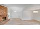 Open-concept living room featuring a brick fireplace, light wood flooring, and modern lighting fixtures at 4227 Coopersdale Rd, Charlotte, NC 28273