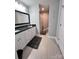 Bright bathroom featuring a granite countertop vanity with double sinks and tiled floors at 440 Mt Moriah Church Rd, China Grove, NC 28023