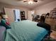 A bedroom featuring a ceiling fan, a bed with blue linens, and a bookcase at 440 Mt Moriah Church Rd, China Grove, NC 28023