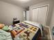 Bedroom with bi-fold doors and featuring neutral grey walls with matching carpet at 440 Mt Moriah Church Rd, China Grove, NC 28023