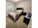 Bedroom showcasing a black bed frame and neutral grey walls with matching carpet at 440 Mt Moriah Church Rd, China Grove, NC 28023