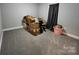 Bedroom with neutral gray walls and gray carpet featuring cardboard boxes at 440 Mt Moriah Church Rd, China Grove, NC 28023