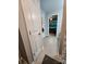 Hallway with gray plank tile leading to a bedroom, linen closet, and a bathroom at 440 Mt Moriah Church Rd, China Grove, NC 28023