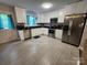 Updated kitchen with stainless steel appliances and white cabinets at 440 Mt Moriah Church Rd, China Grove, NC 28023