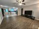 Inviting living room featuring wood flooring and an open layout to the modern kitchen at 440 Mt Moriah Church Rd, China Grove, NC 28023