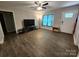 Neutral living room showcases wood flooring and plenty of natural light at 440 Mt Moriah Church Rd, China Grove, NC 28023