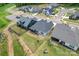 Aerial view showcases a home with a screened porch, landscaping, and a well-maintained yard in a planned community at 471 Lucky Nw Dr, Concord, NC 28027