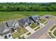 This aerial view showcases meticulously landscaped homes, well-maintained lawns, and tree-lined streets in a tranquil neighborhood at 471 Lucky Nw Dr, Concord, NC 28027