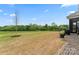 Expansive backyard featuring a large grassy area with a young tree, offering privacy and outdoor space at 471 Lucky Nw Dr, Concord, NC 28027