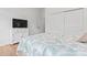Bright bedroom with queen bed, white dresser, and large closet at 471 Lucky Nw Dr, Concord, NC 28027