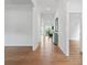 Inviting foyer with gleaming hardwood floors and white trim, leading to the main living areas at 471 Lucky Nw Dr, Concord, NC 28027