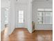 Bright foyer with hardwood floors, white walls, and a glass front door providing ample natural light at 471 Lucky Nw Dr, Concord, NC 28027