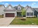 Charming single-story home featuring a well-manicured lawn and an attached two-car garage at 471 Lucky Nw Dr, Concord, NC 28027