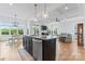 Bright, open kitchen with granite countertops, stainless steel appliances, and view to the living room at 471 Lucky Nw Dr, Concord, NC 28027