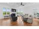 Spacious living room featuring a fireplace, recessed lights, coffered ceiling, and lots of natural light at 471 Lucky Nw Dr, Concord, NC 28027