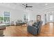 Comfortable living room featuring hardwood floors, lots of natural light, and stylish furniture at 471 Lucky Nw Dr, Concord, NC 28027
