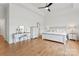 Bright bedroom with hardwood floors, stylish furniture, and soft, natural light from the windows at 471 Lucky Nw Dr, Concord, NC 28027