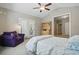 Bright bedroom featuring a ceiling fan, an hutch and dresser, and carpet flooring at 4853 Walnut Grove St, Harrisburg, NC 28075