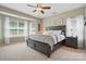 Primary bedroom with ceiling fan and lots of natural light at 4853 Walnut Grove St, Harrisburg, NC 28075