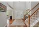 Spacious foyer featuring hardwood floors, staircase, and a column accent at 4853 Walnut Grove St, Harrisburg, NC 28075
