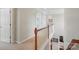 Well-lit upstairs hallway featuring carpet flooring and white trim at 4853 Walnut Grove St, Harrisburg, NC 28075