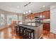 Beautiful kitchen showcasing an island with seating, pendant lights, and stainless steel appliances at 4853 Walnut Grove St, Harrisburg, NC 28075