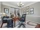Spacious office showcasing a wooden desk, crown molding, and neutral paint scheme at 4853 Walnut Grove St, Harrisburg, NC 28075
