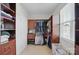 Bright walk-in closet features custom shelving, providing ample storage with convenience and a tidy design at 4853 Walnut Grove St, Harrisburg, NC 28075