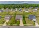 Expansive aerial shot showcasing a neighborhood with well-maintained lawns and various home styles against a backdrop of lush greenery at 4926 Trayton Ave, Gastonia, NC 28056