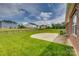 Expansive backyard with a concrete patio, privacy fence, and lush lawn offering space for outdoor enjoyment at 4926 Trayton Ave, Gastonia, NC 28056
