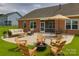 Inviting backyard with a patio, outdoor seating, and a fire pit for gatherings and entertainment at 4926 Trayton Ave, Gastonia, NC 28056