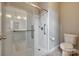 A modern bathroom featuring glass-enclosed shower, sleek fixtures, and accessible design at 4926 Trayton Ave, Gastonia, NC 28056