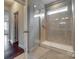 Modern bathroom with a tiled shower, glass enclosure, and a neutral color scheme at 4926 Trayton Ave, Gastonia, NC 28056
