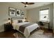 Well-lit bedroom with a modern design featuring stylish decor and study space at 4926 Trayton Ave, Gastonia, NC 28056