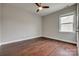 Bedroom with hardwood floors, ceiling fan and neutral paint providing a serene and stylish space at 4926 Trayton Ave, Gastonia, NC 28056