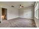 Bedroom featuring neutral carpet, double door closet and natural light from the windows at 4926 Trayton Ave, Gastonia, NC 28056