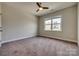 Bedroom featuring plush carpet, neutral walls, ceiling fan and natural light from the window at 4926 Trayton Ave, Gastonia, NC 28056