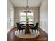 Elegant dining room features modern chandelier, wainscoting, and views of the outdoors at 4926 Trayton Ave, Gastonia, NC 28056
