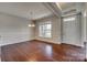 Formal dining room with elegant chandelier, decorative molding, and ample natural light at 4926 Trayton Ave, Gastonia, NC 28056