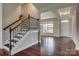 Spacious foyer with hardwood floors, a staircase with wrought iron railings, and natural light at 4926 Trayton Ave, Gastonia, NC 28056