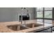 Close up of granite countertop, stainless kitchen sink and faucet at 4926 Trayton Ave, Gastonia, NC 28056