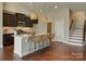 Open kitchen boasts an island with seating, pendant lights, and stainless steel appliances at 4926 Trayton Ave, Gastonia, NC 28056