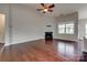 Bright living room with fireplace, ceiling fan, and natural light from the window at 4926 Trayton Ave, Gastonia, NC 28056