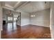 Open-concept living space featuring hardwood floors, a fireplace, and modern design elements at 4926 Trayton Ave, Gastonia, NC 28056